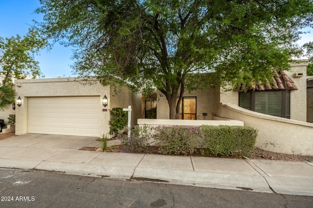 view of front of home with a garage