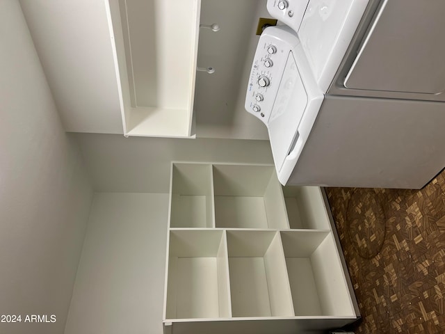 interior space featuring parquet flooring and washer / dryer