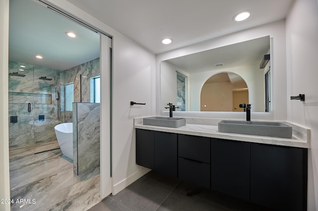 bathroom with vanity, tile patterned flooring, and shower with separate bathtub