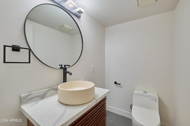 bathroom with vanity and toilet