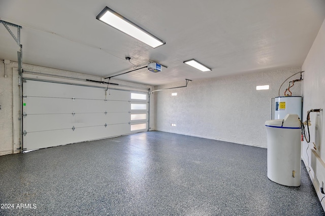 garage featuring a garage door opener and electric water heater