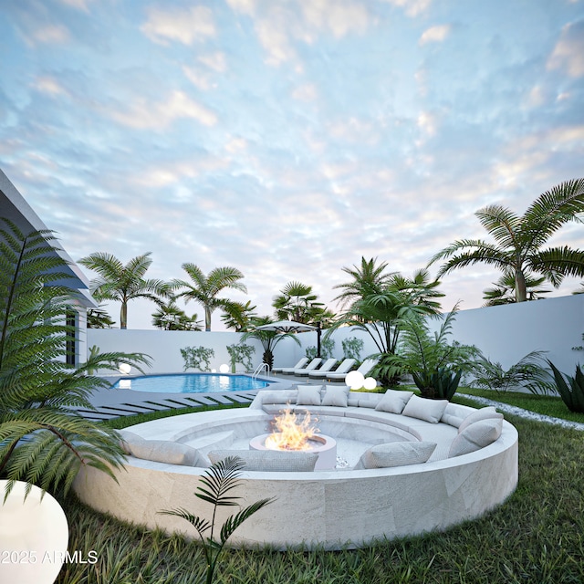 view of swimming pool featuring a fire pit