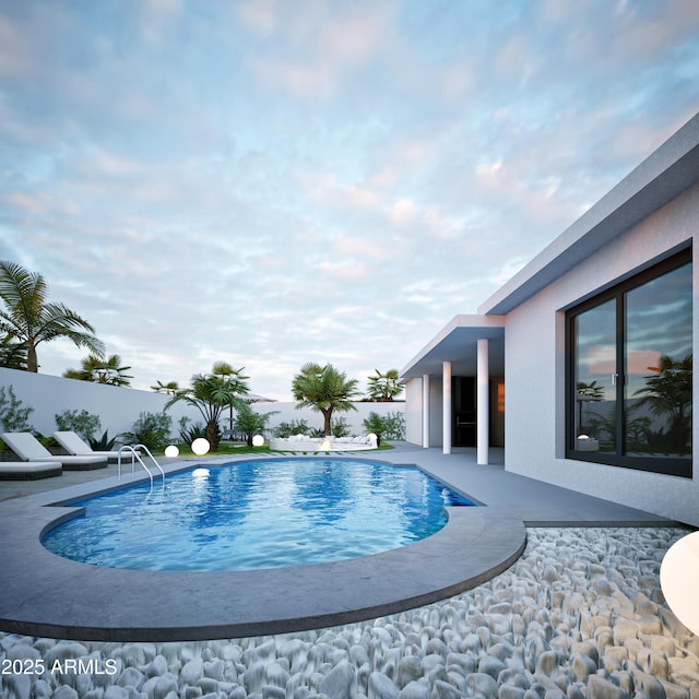 view of swimming pool featuring a patio area