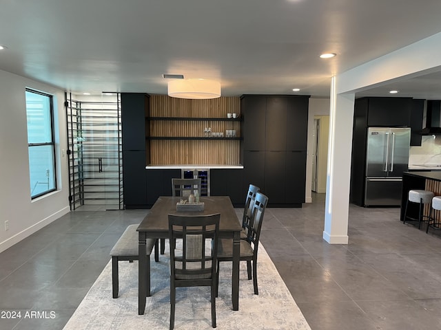 dining area with light tile patterned floors