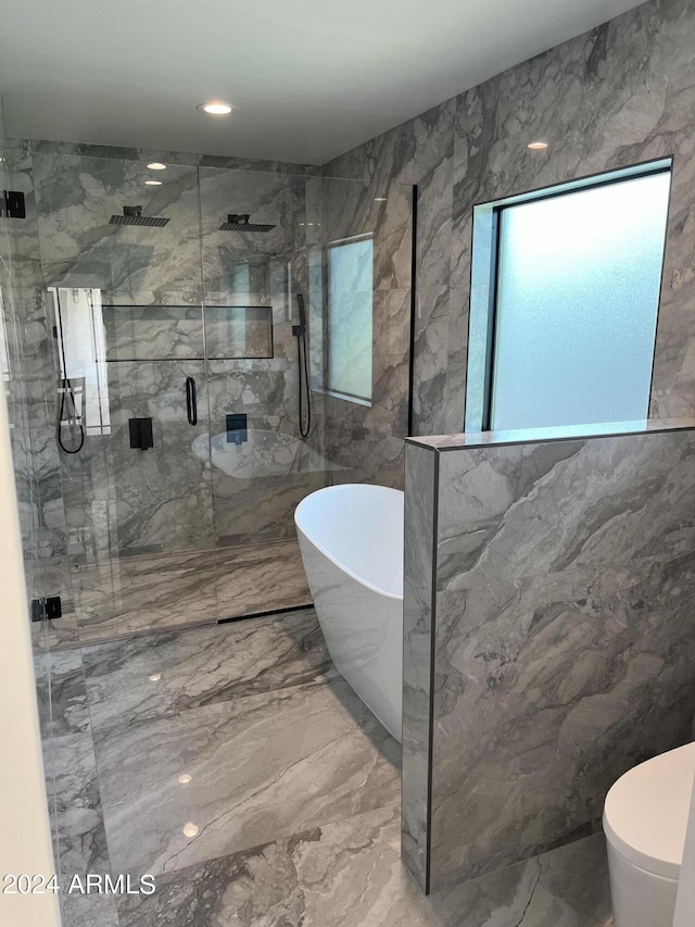 bathroom with separate shower and tub