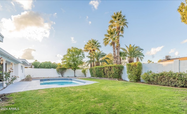 view of pool featuring a yard