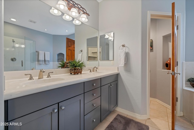 bathroom featuring tile patterned floors, vanity, and an enclosed shower