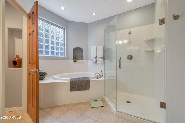 bathroom featuring tile patterned flooring and plus walk in shower