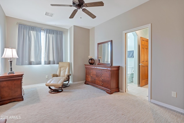 carpeted bedroom featuring ensuite bathroom and ceiling fan