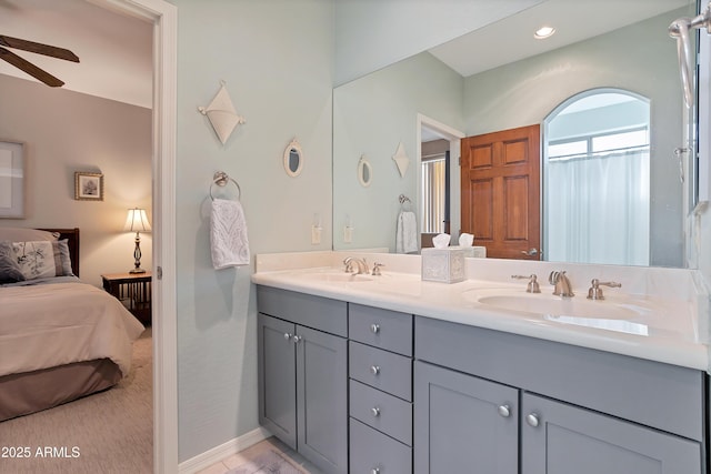 bathroom featuring ceiling fan and vanity