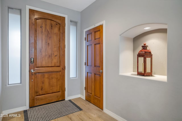 foyer with light hardwood / wood-style floors