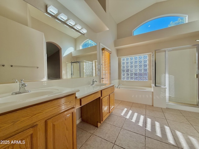 bathroom featuring tile patterned flooring, plenty of natural light, and a sink