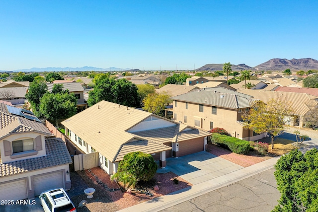 drone / aerial view with a mountain view and a residential view