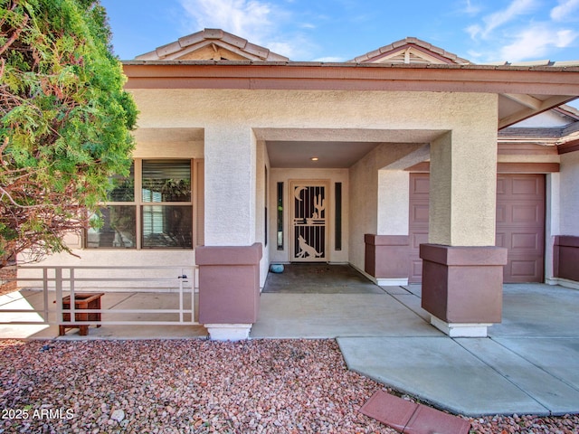 doorway to property with stucco siding