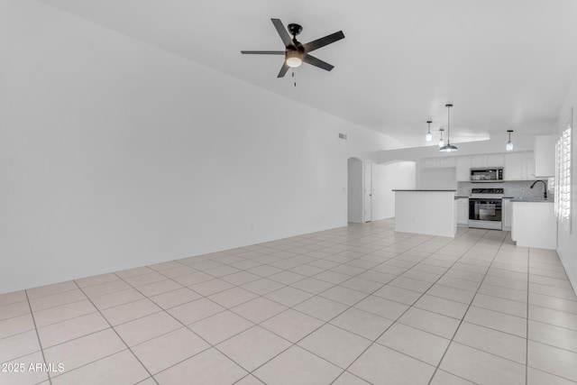 1405 E Chicago Cir, Chandler, AZ 85225 - unfurnished living room featuring arched walkways and ceiling fan