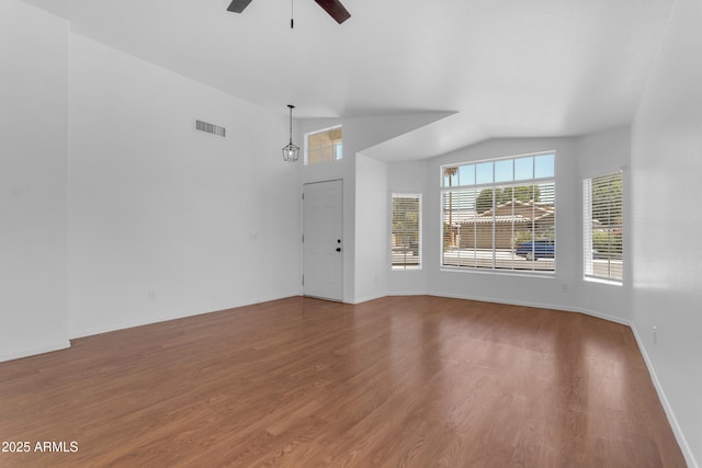 1405 E Chicago Cir, Chandler, AZ 85225 - unfurnished living room with a ceiling fan, wood finished floors, and vaulted ceiling