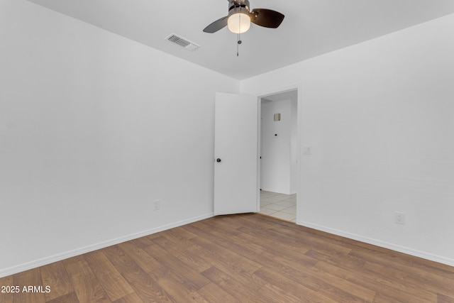 1405 E Chicago Cir, Chandler, AZ 85225 - unfurnished room with a ceiling fan and wood finished floors