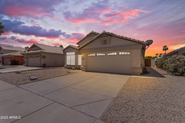 1405 E Chicago Cir, Chandler, AZ 85225 - view of front of property with an attached garage, driveway, stucco siding, and a tiled roof