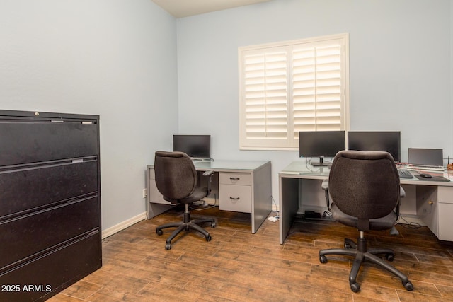 home office featuring baseboards and wood finished floors