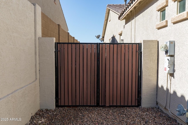 view of gate with fence