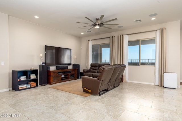 living room featuring recessed lighting, visible vents, baseboards, and a ceiling fan