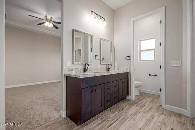 29785 N 203rd Dr, Wittmann, AZ 85361 - full bath featuring a ceiling fan, baseboards, wood finished floors, and toilet