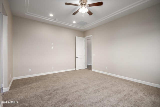 29785 N 203rd Dr, Wittmann, AZ 85361 - carpeted spare room with a ceiling fan, recessed lighting, a tray ceiling, and baseboards