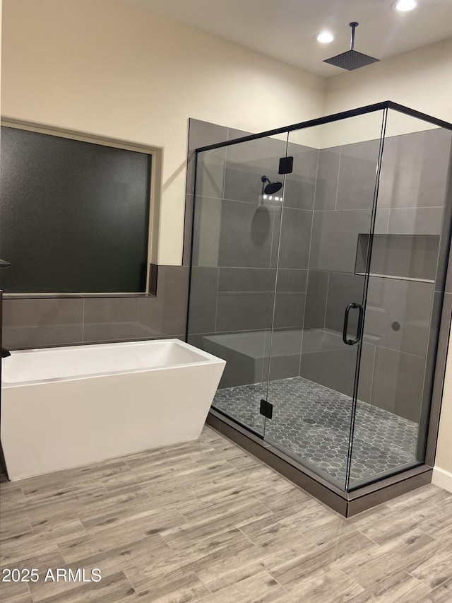 29785 N 203rd Dr, Wittmann, AZ 85361 - bathroom with a freestanding bath, wood finished floors, a shower stall, and recessed lighting