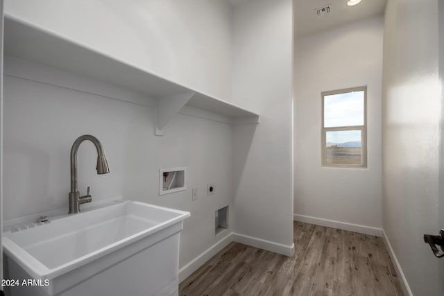 29785 N 203rd Dr, Wittmann, AZ 85361 - washroom featuring electric dryer hookup, washer hookup, light wood-type flooring, and baseboards