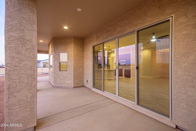 view of patio terrace at dusk