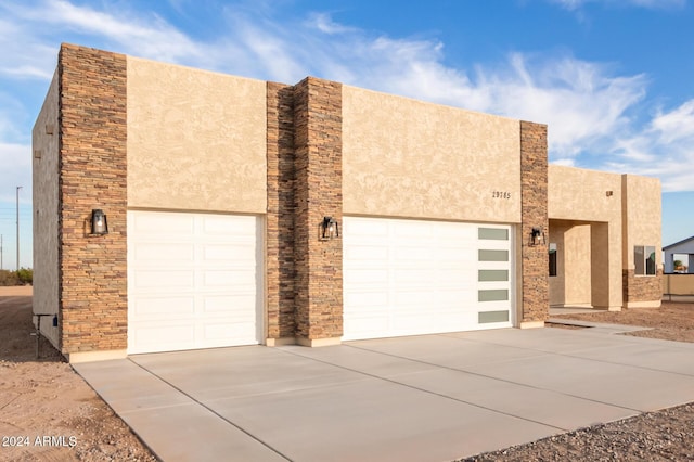 29785 N 203rd Dr, Wittmann, AZ 85361 - view of front of property featuring stucco siding, driveway, and a garage