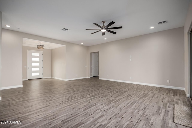 29785 N 203rd Dr, Wittmann, AZ 85361 - unfurnished living room with wood finished floors, a ceiling fan, baseboards, and recessed lighting