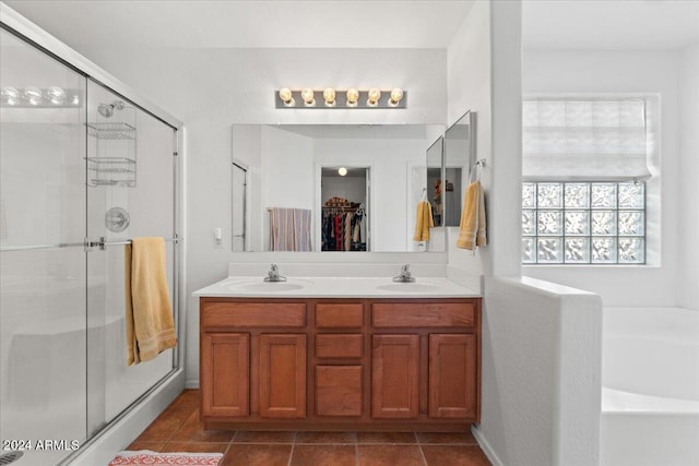 bathroom with vanity, tile patterned floors, and independent shower and bath