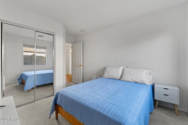 carpeted bedroom with a closet