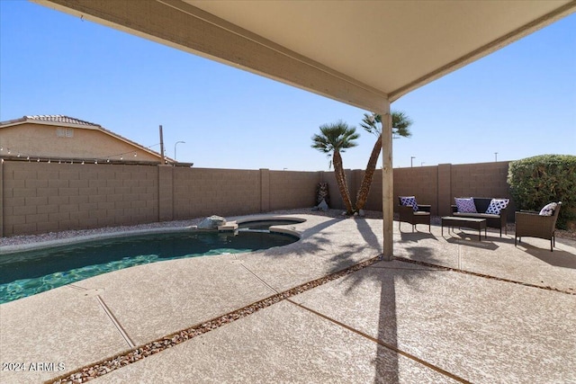 view of pool with a patio area and an in ground hot tub