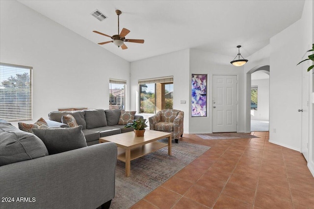 living room with tile patterned flooring, high vaulted ceiling, and ceiling fan