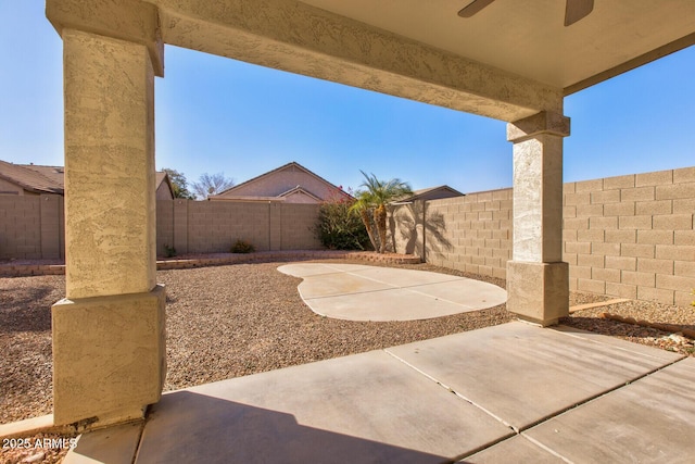 view of patio featuring ceiling fan