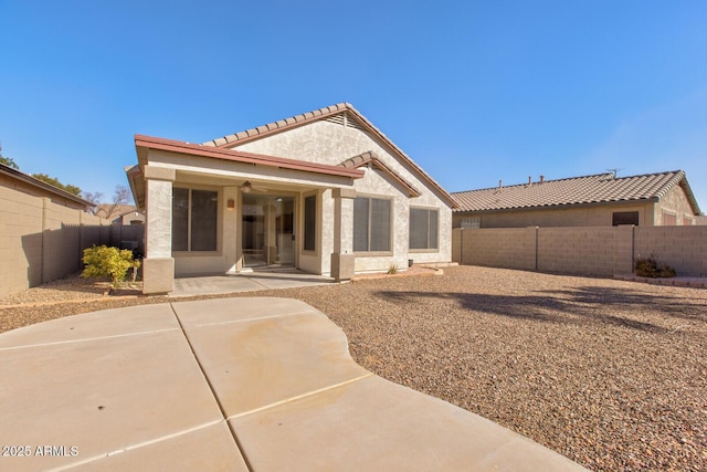 rear view of house with a patio