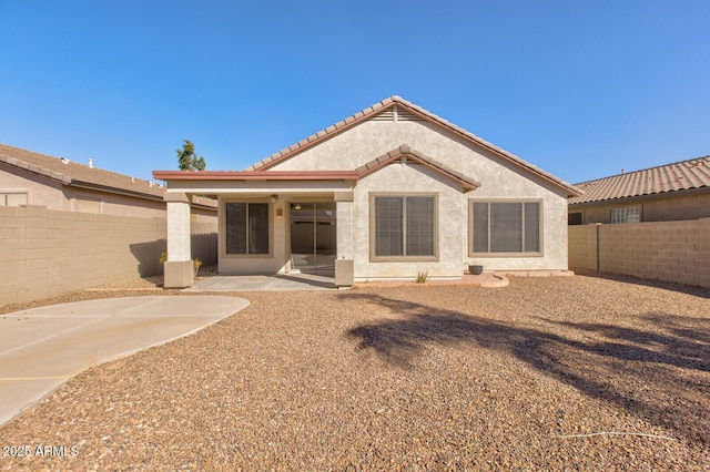 rear view of property with a patio