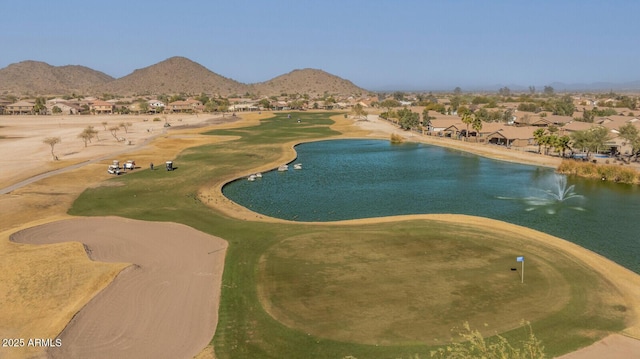 birds eye view of property featuring a water and mountain view