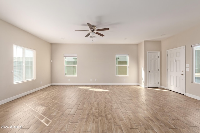 empty room featuring light wood-type flooring and ceiling fan