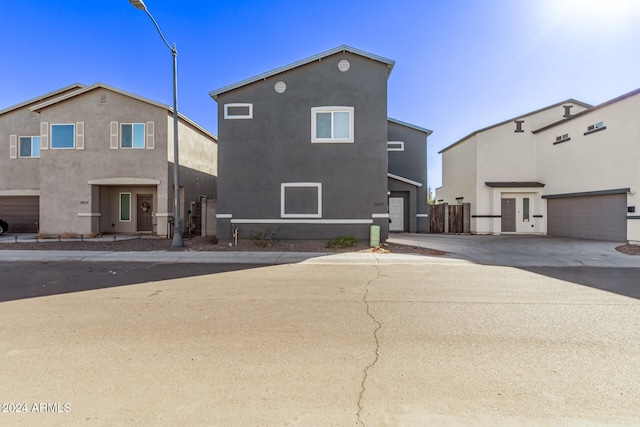 back of property with a garage