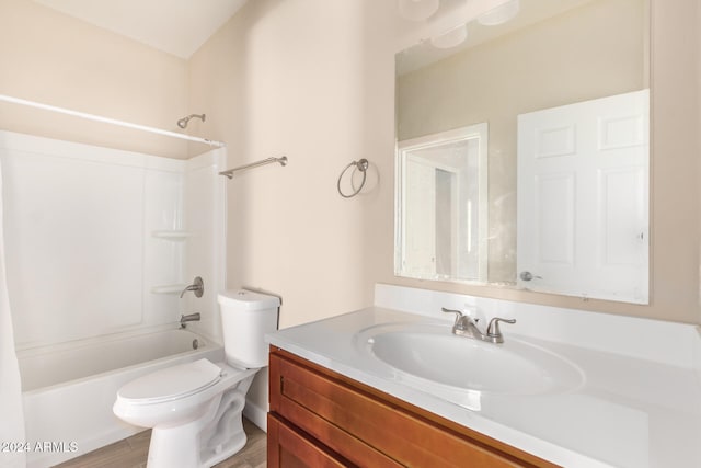 full bathroom featuring vanity, toilet, shower / washtub combination, and hardwood / wood-style floors