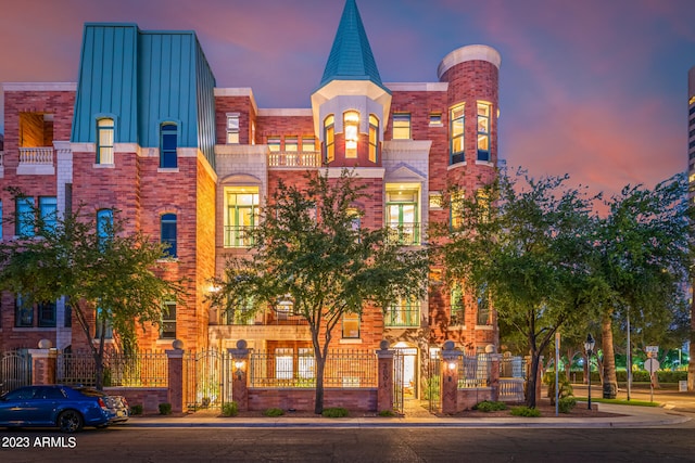 view of outdoor building at dusk