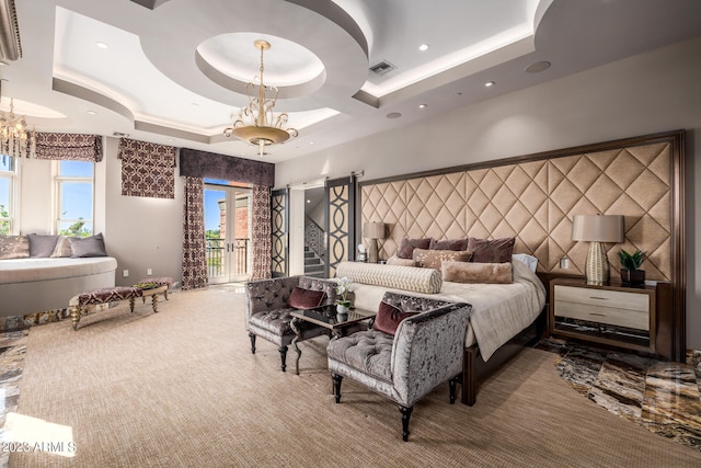 2001 N 1st Ave, Phoenix, AZ 85003 - carpeted bedroom featuring an inviting chandelier, access to outside, a tray ceiling, and multiple windows