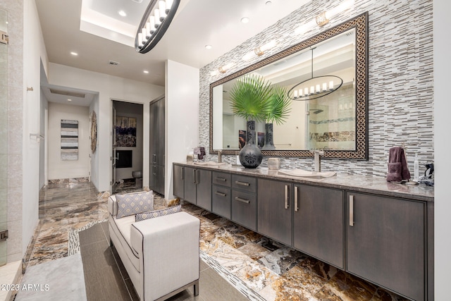 2001 N 1st Ave, Phoenix, AZ 85003 - bathroom featuring double sink, tile floors, a chandelier, a raised ceiling, and oversized vanity