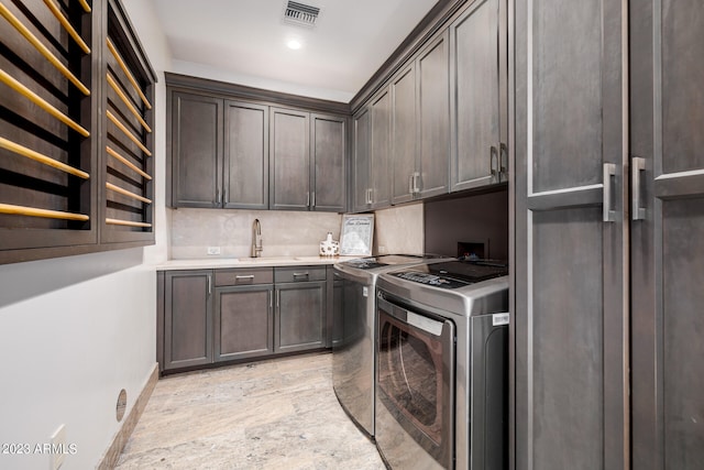 2001 N 1st Ave, Phoenix, AZ 85003 - washroom with sink, cabinets, washer and dryer, and hookup for a washing machine
