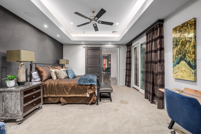 2001 N 1st Ave, Phoenix, AZ 85003 - bedroom with light carpet, a barn door, ceiling fan, a tray ceiling, and access to outside