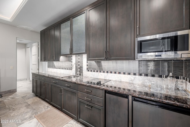 2001 N 1st Ave, Phoenix, AZ 85003 - kitchen featuring tasteful backsplash, dark brown cabinetry, dark stone countertops, and light tile floors