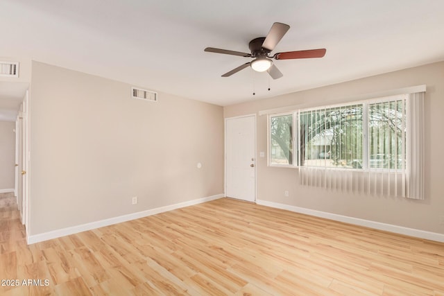 unfurnished room featuring ceiling fan, plenty of natural light, and light hardwood / wood-style floors